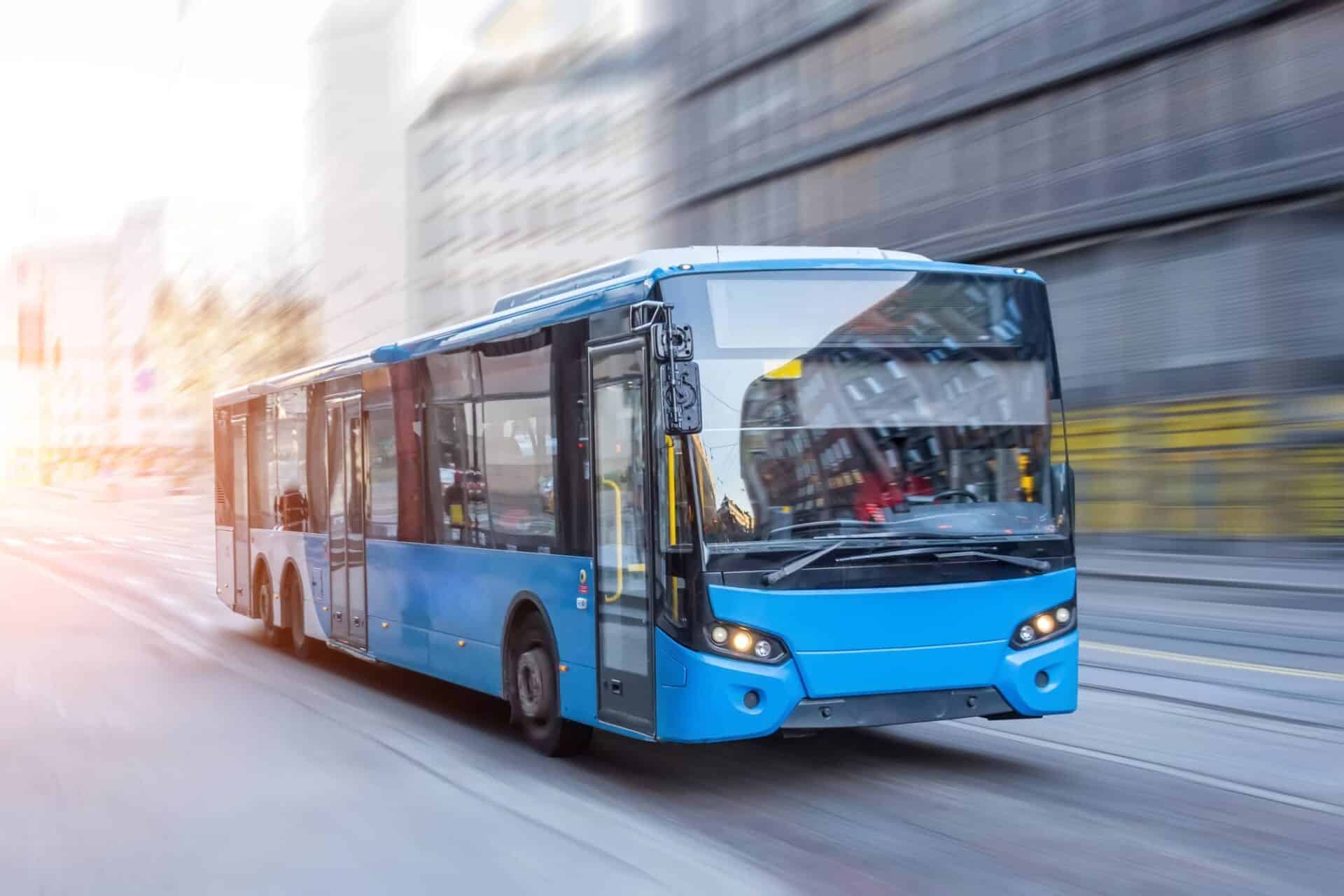 city bus driving through town